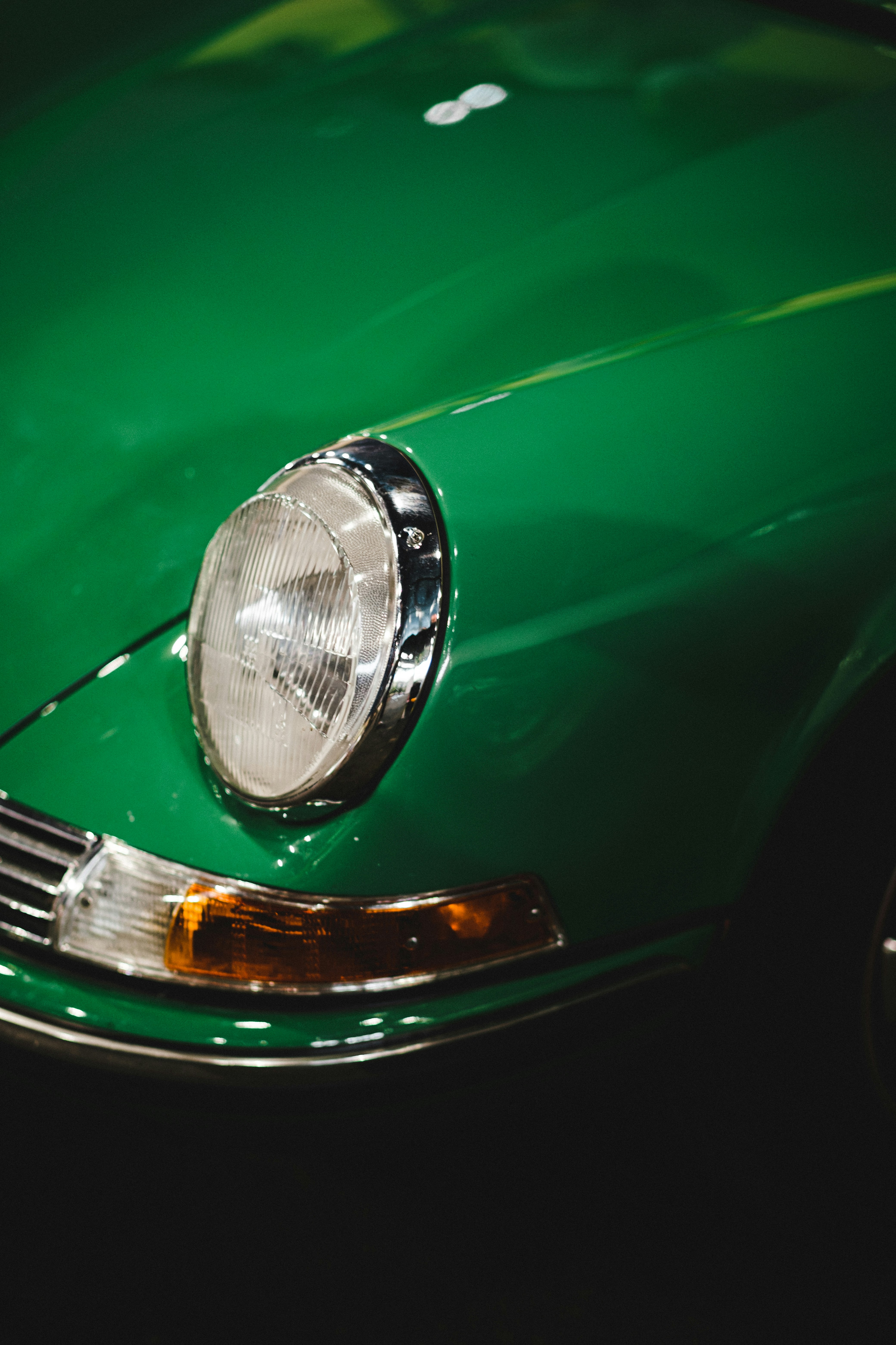 green car with silver headlight